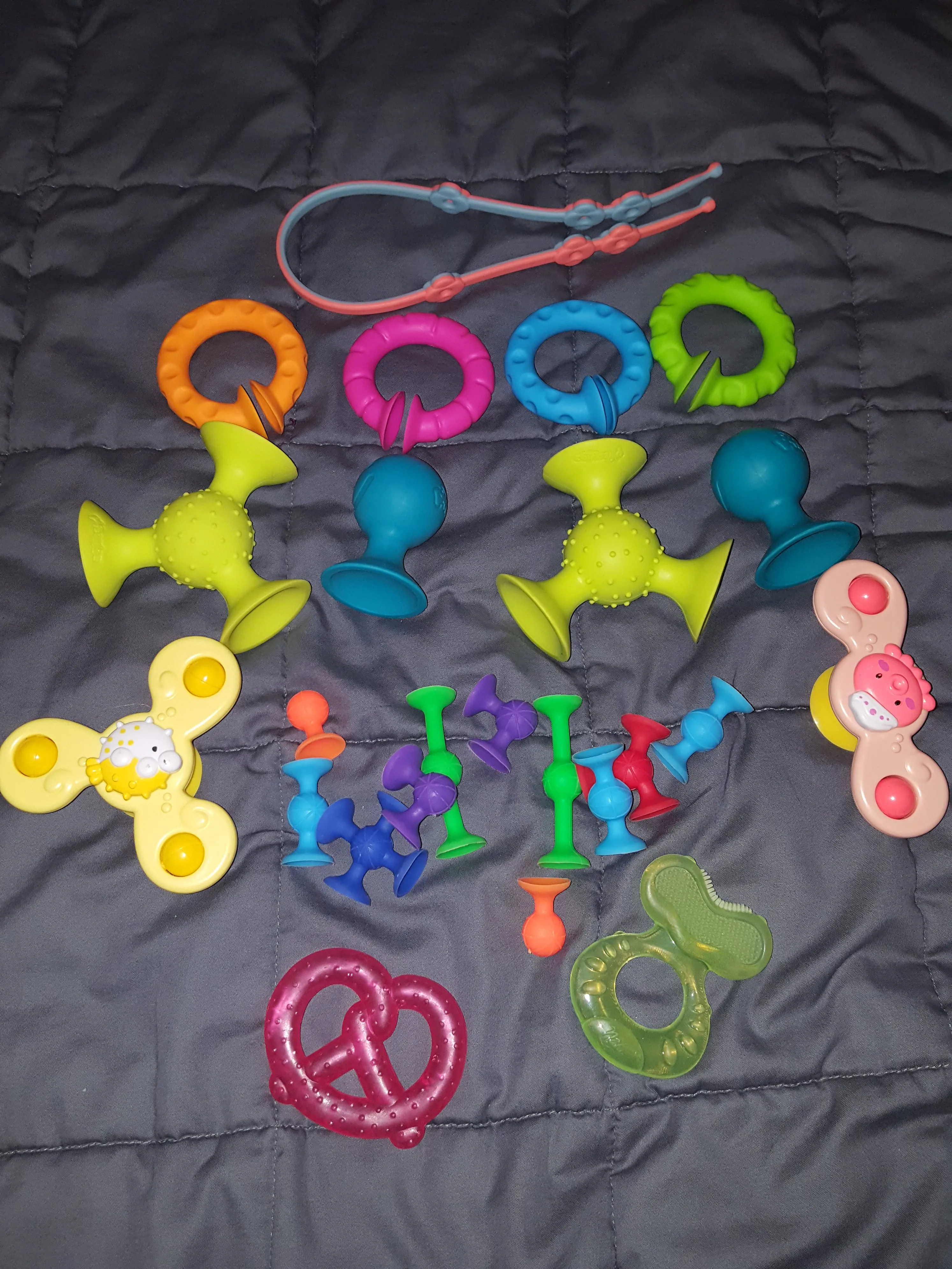 assortment of baby toys (pipsquigz big & little, - size